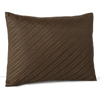 Glinting threads of copper stitched on a diagonal adorn this earthy decorative pillow from Calvin Klein Home. Glinting threads of copper stitched on a diagonal adorn this earthy decorative pillow from Calvin Klein Home.