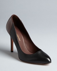 Perfect for work travel, these Bruno Magli pumps are colorblocked in black and a neutral burgundy, matching everything in your business wardrobe. Perfect for work travel, these Bruno Magli pumps are colorblocked in black and a neutral burgundy, matching everything in your business wardrobe.