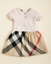 A check printed ruffle at the hem adds a playful touch to a classic Burberry dress, crafted in the softest cotton jersey. A check printed ruffle at the hem adds a playful touch to a classic Burberry dress, crafted in the softest cotton jersey.
