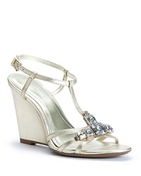 These elegant Calvin Klein evening sandals, with cutting-edge crystal embellishments, will let you dance the entire night away thanks to wearable wedge heels. These elegant Calvin Klein evening sandals, with cutting-edge crystal embellishments, will let you dance the entire night away thanks to wearable wedge heels.