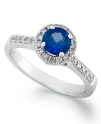 Simply stunning. This exquisite ring features a round-cut tanzanite (1/2 ct. t.w.) surrounded by a halo of round-cut diamonds (1/4 ct. t.w.). Set in sterling silver. Size 7. Simply stunning. This exquisite ring features a round-cut tanzanite (1/2 ct. t.w.) surrounded by a halo of round-cut diamonds (1/4 ct. t.w.). Set in sterling silver. Size 7.