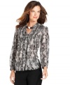 A chic print and subtle pleats give this petite shirt from Jones New York Signature a stylish upgrade!