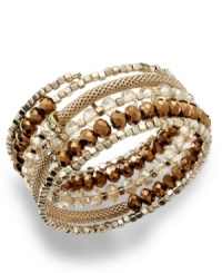 Wrap your wrists with edgy glam. INC International Concepts' coil bracelet features a mix of glass and plastic rondelles with a snake chain. Set in 12k gold-plated mixed metal. Approximate length (when stretched): 7 inches. Wrap your wrists with edgy glam. INC International Concepts' coil bracelet features a mix of glass and plastic rondelles with a snake chain. Set in 12k gold-plated mixed metal. Approximate length (when stretched): 7 inches.
