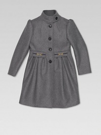 A beautiful, button-front felt coat with horsebit detail, front pockets and GG lining.Stand up collarLong sleevesButton-frontFlap pockets with metal horsebit and pleatsBack button panel70% wool/20% polyamide/10% cashmereDry cleanMade in Italy Please note: Number of buttons may vary depending on size ordered. 