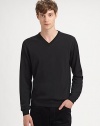 A casual-to-dressy must-have for the modern man, with a flattering v-neck and fitted ribbed sleeves.Ribbed v-neckLong sleeves with ribbed cuffsRibbed hemMerino woolHand wash or dry cleanImported