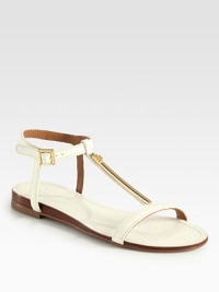 A sleek goldtone detail adds luxe style to this comfortable leather design with an adjustable ankle strap. Leather upperAdjustable ankle strapLeather liningRubber solePadded insoleImported