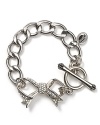 Juicy Couture takes their cult favorite starter bracelet in a dainty direction with a new pavé bow pendant.