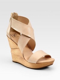 Wide leather criss-cross straps and an exposed back zipper top an architectural wooden wedge. Wooden wedge, 4½ (115mm)Wooden platform, 1 (25mm)Compares to a 3½ heel (90mm)Leather upperBack zipperLeather liningRubber solePadded insoleImportedOUR FIT MODEL RECOMMENDS ordering one half size up as this style runs small. Wide leather criss-cross straps and an exposed back zipper top an architectural wooden wedge. Wooden wedge, 4½ (115mm)Wooden platform, 1 (25mm)Compares to a 3½ heel (90mm)Leather upperBack zipperLeather liningRubber solePadded insoleImportedOUR FIT MODEL RECOMMENDS ordering one half size up as this style runs small.