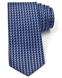 Add some 3D flair to your office attire with this handsome tie featuring an allover pattern of tonal cubes. Add some 3D flair to your office attire with this handsome tie featuring an allover pattern of tonal cubes.