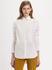 Classic button-down shirt renewed by a notched bib detail, hi-lo hem and silk trim. Point collarButton frontLong sleevesHi-lo hemBody: 95% cotton/5% polyurethane; Contrast: SilkDry cleanImportedModel shown is 5'10 (177cm) wearing US size 2. Classic button-down shirt renewed by a notched bib detail, hi-lo hem and silk trim. Point collarButton frontLong sleevesHi-lo hemBody: 95% cotton/5% polyurethane; Contrast: SilkDry cleanImportedModel shown is 5'10 (177cm) wearing US size 2.
