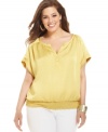 Lend a polished finish to your casual looks with Alfani's short sleeve plus size top, punctuated by a smocked hem.