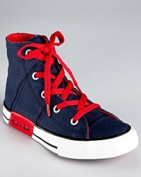 Criss cross topstitching and clever contrast accents update Converse' classic high top sneaker for the 21st century. Criss cross topstitching and clever contrast accents update Converse' classic high top sneaker for the 21st century.