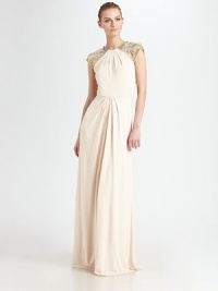 Sleek and timeless, this elegant floor-length style features delicate pleated details and jeweled cap sleeves.Jewel necklineBeaded cap sleevesFront pleats on bodice and skirtBack keyhole with button closureConcealed back zipFully linedAbout 48 from natural waist71% rayon/29% polyesterSpot cleanMade in USA of imported fabricModel shown is 5'10½ (179cm) wearing US size 4.OUR FIT MODEL RECOMMENDS ordering true size. Sleek and timeless, this elegant floor-length style features delicate pleated details and jeweled cap sleeves.Jewel necklineBeaded cap sleevesFront pleats on bodice and skirtBack keyhole with button closureConcealed back zipFully linedAbout 48 from natural waist71% rayon/29% polyesterSpot cleanMade in USA of imported fabricModel shown is 5'10½ (179cm) wearing US size 4.OUR FIT MODEL RECOMMENDS ordering true size.