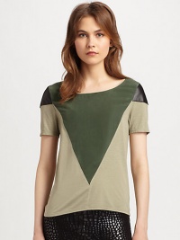Geometric panels of silk and leather define this lightweight, colorblocked top. BoatneckLeather-trimmed shouldersShort sleevesBody: 60% viscose/25% nylon/15% angora; Contrast: SilkDry clean with leather specialistMade in USA of imported fabricModel shown is 5'9½ (176cm) wearing US size Small. Geometric panels of silk and leather define this lightweight, colorblocked top. BoatneckLeather-trimmed shouldersShort sleevesBody: 60% viscose/25% nylon/15% angora; Contrast: SilkDry clean with leather specialistMade in USA of imported fabricModel shown is 5'9½ (176cm) wearing US size Small.