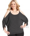 Sass up your look with MICHAEL Michael Kors' polka-dot plus size top, featuring cutouts and chain detail.