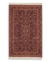 Richly detailed and deeply colored, the exotic floral motif of this rug made its debut in twentieth-century America and has remained a favorite. Individual skein-dyeing imparts a jewel-tone clarity to the rich red, green and ivory palette. A patented wash process creates a soft vintage finish faithful to the craftsmanship of the original. Woven in the USA of premium fully worsted New Zealand wool.