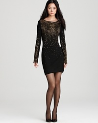 Cascading rhinestones on this Cynthia Steffe dress add high-shine glamor in a look that's good as gold. Cascading rhinestones on this Cynthia Steffe dress add high-shine glamor in a look that's good as gold.