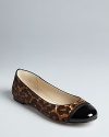 MICHAEL Michael Kors has fashionable flats covered in this style, which picks up the cap toe and exotic print trends. Moto zipper accents finish off the look.
