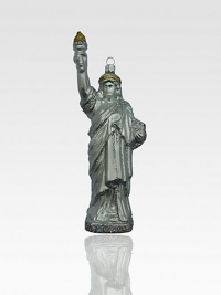 Celebrate freedom this holiday season by hanging a glittering Statue of Liberty ornament on your tree.Handmade and hand-paintedGlassAbout 8H X 3W X 1.75DImported Celebrate freedom this holiday season by hanging a glittering Statue of Liberty ornament on your tree.Handmade and hand-paintedGlassAbout 8H X 3W X 1.75DImported