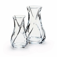 Smooth, fluid lines and lithe shape suggest the languorous movement of a serpent. A shape so supple and graceful, it looks almost as if it would respond to touch. Shown left to right: 5 7/8 serpentine vase, 7 7/8 serpentine vase. Also available: 9 7/8 serpentine vase. Smooth, fluid lines and lithe shape suggest the languorous movement of a serpent. A shape so supple and graceful, it looks almost as if it would respond to touch. Shown left to right: 5 7/8 serpentine vase, 7 7/8 serpentine vase. Also available: 9 7/8 serpentine vase.