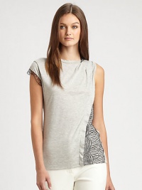 A tee with some twists, this sleeveless style is shaped with tiny pleats at one shoulder and lace trim and overlays for an edgy appeal.Round banded neckline with lace trim on one sideSleeveless on one side, cap sleeve with lace trim on the otherPleats at one shoulderAsymmetrical flange and lace overlay on one sideAbout 26 from shoulder to hemCotton/modalDry cleanImported of Italian fabricSIZE & FITModel shown is 5'10 (177cm) wearing US size Small. A tee with some twists, this sleeveless style is shaped with tiny pleats at one shoulder and lace trim and overlays for an edgy appeal.Round banded neckline with lace trim on one sideSleeveless on one side, cap sleeve with lace trim on the otherPleats at one shoulderAsymmetrical flange and lace overlay on one sideAbout 26 from shoulder to hemCotton/modalDry cleanImported of Italian fabricSIZE & FITModel shown is 5'10 (177cm) wearing US size Small.
