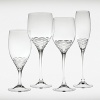Renowned British fashion designer Jasper Conan introduces a new range of updated formal crystal stemware. In creating each stemware pattern, Mr. Conran brought his signature aesthetic mixing classic British elegance with a cheeky irreverent attitude. The horizontal cuts of the Rosette stemware pattern by Jasper Conran highlight the base of the vessel to resemble petals of the most delicate rose and will be perfect for your next toast.
