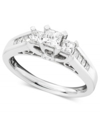 Fit for a princess! Three princess-cut stones are prong set in 14k white gold nestled within the sparkle of princess-cut, channel-set diamonds (1 ct. t.w.).