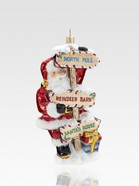 Gorgeous glittered signs point the way to St. Nick's most festive locales in this beautiful piece, rendered in exquisite mouthblown and hand-painted glass.Hand-painted glass7 highImported Gorgeous glittered signs point the way to St. Nick's most festive locales in this beautiful piece, rendered in exquisite mouthblown and hand-painted glass.Hand-painted glass7 highImported