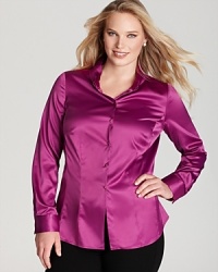 Make a dramatic exit in a lustrous Tahari Woman Plus blouse flaunting a contrast knit back for serious fashion presence. Make a dramatic exit in a lustrous Tahari Woman Plus blouse flaunting a contrast knit back for serious fashion presence.