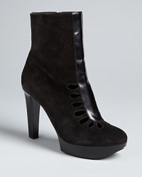 French design house Robert Clergerie injects this platform bootie with serious chic, from intricately cut out top to patent leather heel. C'est magnifique. French design house Robert Clergerie injects this platform bootie with serious chic, from intricately cut out top to patent leather heel. C'est magnifique.