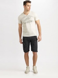A soft v-neck crafted of ultra-soft combed cotton, with an iconic Chuck Taylor graphic logo. V-neckShort sleevesAbout 28 from shoulder to hemMachine washImported A soft v-neck crafted of ultra-soft combed cotton, with an iconic Chuck Taylor graphic logo. V-neckShort sleevesAbout 28 from shoulder to hemMachine washImported