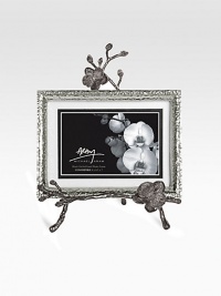 A two-piece easel-style frame finds inspiration in the textures of nature, crafted in hammered and blackened nickel-plated metal by one of America's premier metalwork artists. From the Black Orchid CollectionOverall, 8 X 10½Accommodates a 4 X 6 or 5 X 7 photographImported A two-piece easel-style frame finds inspiration in the textures of nature, crafted in hammered and blackened nickel-plated metal by one of America's premier metalwork artists. From the Black Orchid CollectionOverall, 8 X 10½Accommodates a 4 X 6 or 5 X 7 photographImported