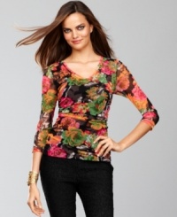 Subtle but colorful, INC chooses a blooming floral print to adorn the mesh fabric of this sophisticated ruched top. Subtle but colorful, INC chooses a blooming floral print to adorn the mesh fabric of this sophisticated ruched top.