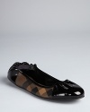 Darkly sophisticated, smoked check plaid and patent leather combine to give these Burberry ballerina flats edge.