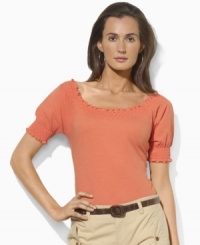 Imbued with breezy bohemian style, Lauren by Ralph Lauren's soft cotton jersey top gets a romantic update with a smocked neckline and cuffs. Imbued with breezy bohemian style, Lauren by Ralph Lauren's soft cotton jersey top gets a romantic update with a smocked neckline and cuffs.