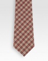 Handsome plaid pattern adorns this design crafted in Italy of a luxurious blend of wool and silk.About 2.8 wide60% wool/40% silkDry cleanMade in Italy