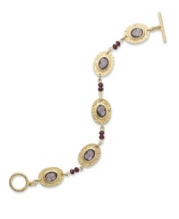 Alluring amethyst hues create a timeless feel to this bracelet from Lauren Ralph Lauren. Textured oval pendants highlight glass cabochons. Ring and toggle closure. Crafted in 14k worn gold-plated brass. Approximate length: 7-1/2 inches.