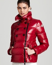 Moncler's lacquered Daim coat boasts a forward asymmetrical zip front and a decorative, double breasted silhouette. Moncler's lacquered Daim coat boasts a forward asymmetrical zip front and a decorative, double breasted silhouette.