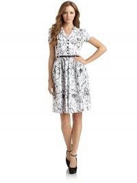 THE LOOKEmbroidered flower designNotch lapelFront button closureShort puff sleevesButton patch pocketsBelt with buckle closurePleated waistFull skirtTHE FITAbout 36 from shoulder to hemTHE MATERIALCottonCARE & ORIGINDry cleanMade in ItalyModel shown is 5'9 (175cm) wearing US size 4. THE LOOKEmbroidered flower designNotch lapelFront button closureShort puff sleevesButton patch pocketsBelt with buckle closurePleated waistFull skirtTHE FITAbout 36 from shoulder to hemTHE MATERIALCottonCARE & ORIGINDry cleanMade in ItalyModel shown is 5'9 (175cm) wearing US size 4.