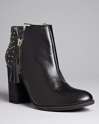 These SCHUTZ moto booties strike the right balance between mild and wild, with tiny, sparkling studs that don't overdo it: Rebellion, restrained. These SCHUTZ moto booties strike the right balance between mild and wild, with tiny, sparkling studs that don't overdo it: Rebellion, restrained.