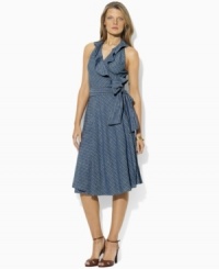 Drawing inspiration from classic menswear style with slim stripes and soft chambray shirting, Lauren Jeans Co.'s flattering wrap design is decidedly feminine with a ruffled V-neckline and full, flowing skirt. Drawing inspiration from classic menswear style with slim stripes and soft chambray shirting, Lauren Jeans Co.'s flattering wrap design is decidedly feminine with a ruffled V-neckline and full, flowing skirt.