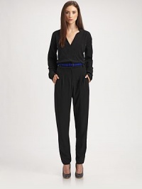 This silky, impeccably tailored one-piece is the epitome of minimal elegance.Surplice neckline with side notchesLong sleeves with underarm ventsBanded waist with belt loopsIncluded beltZip flyFront pleatsSide slash pocketsInseam, about 3351% acetate/49% viscoseDry cleanMade in USA of Italian fabricModel shown is 5'10 (177cm) wearing US size 4. This silky, impeccably tailored one-piece is the epitome of minimal elegance.Surplice neckline with side notchesLong sleeves with underarm ventsBanded waist with belt loopsIncluded beltZip flyFront pleatsSide slash pocketsInseam, about 3351% acetate/49% viscoseDry cleanMade in USA of Italian fabricModel shown is 5'10 (177cm) wearing US size 4.