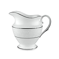 With enameled pearl-like dots, an opalescent background, and the innocence of bone china, Opal Innocence is a romantic pattern of understated elegance. Two bands of platinum a slightly wider one on the rim, kissing a thin fluted design, and a narrower one inside the border adorn each plate. The cup bears additional platinum on its graceful handle and another band at midpoint. Each piece is decorated with a flowing, white-on-white vine design peppered with enamel dots. This service creates a splendid formal table setting and, because of its neutral coloring, works well with any table décor. With enameled pearl-like dots, an opalescent background, and the innocence of bone china, Opal Innocence is a romantic pattern of understated elegance. Two bands of platinum a slightly wider one on the rim, kissing a thin fluted design, and a narrower one inside the border adorn each plate. The cup bears additional platinum on its graceful handle and another band at midpoint. Each piece is decorated with a flowing, white-on-white vine design peppered with enamel dots. This service creates a splendid formal table setting and, because of its neutral coloring, works well with any table décor.