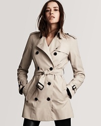 Burberry London's timeless trench evokes endless wear with a versatile short length and slimming, belted silhouette. Burberry London's timeless trench evokes endless wear with a versatile short length and slimming, belted silhouette.
