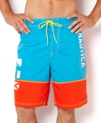 Get colorful by water in these bright board shorts by Nautica. Get colorful by water in these bright board shorts by Nautica.