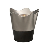 Illuminate your world with the uncompromising majesty of the Southwest. For the first time, designer Neil Cohen pairs sleek black granite with signature Nambé alloy. Part of the initial series of the Nambé Rocks Collection, the elegantly fluted Votive will bring inviting flickers of warmth to your dining room or living area with sophistication and style. Dramatically anchored in granite, the gleaming metal is tarnish-resistant and polishes to a reflective luster that stays bright. Illuminate your world with the uncompromising majesty of the Southwest. For the first time, designer Neil Cohen pairs sleek black granite with signature Nambé alloy. Part of the initial series of the Nambé Rocks Collection, the elegantly fluted Votive will bring inviting flickers of warmth to your dining room or living area with sophistication and style. Dramatically anchored in granite, the gleaming metal is tarnish-resistant and polishes to a reflective luster that stays bright.