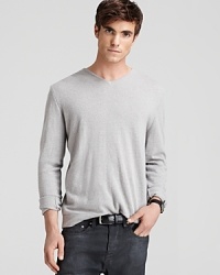 Powerfully soft cashmere maximizes comfort and demonstrates your keen sartorial sensibility with this handsome V-neck sweater from John Varvatos. Powerfully soft cashmere maximizes comfort and demonstrates your keen sartorial sensibility with this handsome V-neck sweater from John Varvatos.