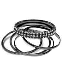 Sleek and stylish, this set of five bangles from GUESS is crafted from hematite-tone mixed metal. Glass crystal stones add a chic touch. Approximate diameter: 1-1/2 inches. Sleek and stylish, this set of five bangles from GUESS is crafted from hematite-tone mixed metal. Glass crystal stones add a chic touch. Approximate diameter: 1-1/2 inches.