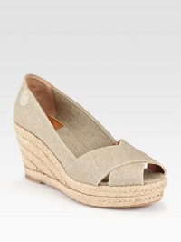 Textured rope covers the wedge of this easy staple in shimmering metallic linen with crisscrossed straps. Covered wedge, 3 (75mm)Covered platform, 1¼ (30mm)Compares to a 1¾ heel (45mm)Metallic linen upperLeather liningRubber solePadded insoleMade in Spain Textured rope covers the wedge of this easy staple in shimmering metallic linen with crisscrossed straps. Covered wedge, 3 (75mm)Covered platform, 1¼ (30mm)Compares to a 1¾ heel (45mm)Metallic linen upperLeather liningRubber solePadded insoleMade in Spain