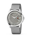 A diamante embossed face on a steel mesh strap lends Gucci's signature look to this versatile, timeless wristwatch.